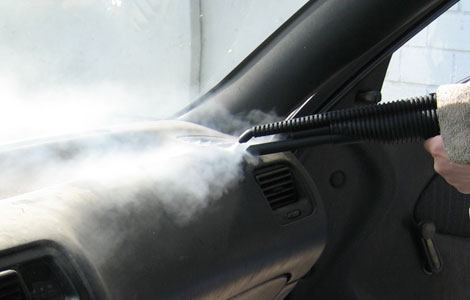 Car dashboard steam vapour cleaning